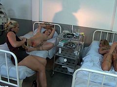 Welcome to see a bondage session right in the madhouse presented in steamy 21 Sextury xxx clip. Brunette and blond dykes in black stuff ties up submissive gal with ropes and polish her wet pussy with a dildo right on the bunk bed.
