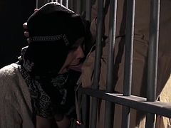 Hot arab babe enjoys a large dick by sucking it while in the prison