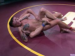 Hayden Richards and Jace Chambers are having a battle on tatami. The winner mouth-fucks the loser and then smashes his butt doggy style.