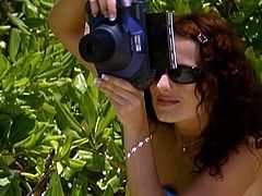 Salacious milf Veronica Sinclair is getting naughty with some guy on a beach. They have awesome oral sex and then bang in side-by-side position on a stone.