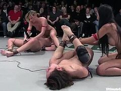 Four chicks in two teams fight each other in a ring. Then girls from the losing team get toyed rough with strap-ons. One of them gets toyed in both holes at the same time.