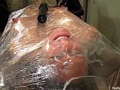 Busty blonde Rain DeGrey gets tormented in a basement and likes it