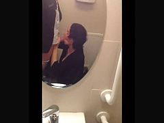 Sucking cock on a public toilet