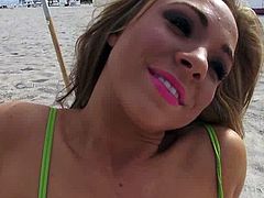 She was so naughty to see all those muscled dudes on the beach! So, she gets in a private place and starts rubbing her twat.