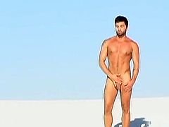 With hot white sand under foot and the heat of the summer sun beating down from above, muscled stud Dominic wanders naked for all to see. His nude body glistens in the sun, his thick and heavy cock swinging and ready to be milked dry. He falls to his knees, his boner throbbing for release, and enjoys an intense jerk off with a fountain of thick cum erupting from his shaft!