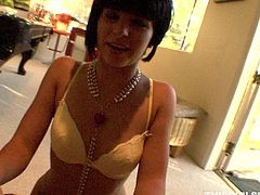 Sensual brunette wearing white bra and panties kneels down to give eager blowjob. She does her best trying to suck out all his cum.