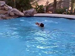 Lovely shemale swims and plays in the pool