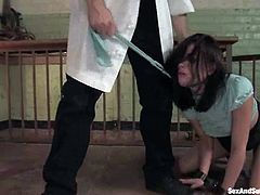 Hot brunette girl gets whipped and humiliated. After that she gets tied up with straps and pounded on a table.