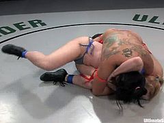 And this is what a hardcore lesbian fight is about! Smoking hot Asian wrestler takes that lust named Darling in an armlock and fucks her with a toy!