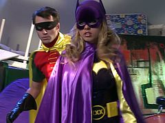 A man is wearing clown costume. Women are wearing super hero costumes. The whole scene is funny and edgy. But the scene changes to steamy FFM fuck scene a bit later.