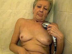 Watch this old but still horny old babe pleasing herself while taking a shower in her bathroom in Old Nanny sex clips.
