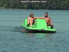 Attractive chick gets on a boat with three horny studs. It is obvious that they seduced her for sex. So she gives them deepthroat blowjob in the open air,