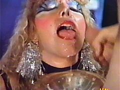 She is a filthy and horny woman! This is a retro tape and she gets a thick cock in her mouth, having put a weird makeup on her cute face.