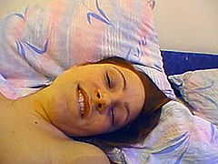 Slim girl takes her clothes off in homemade video. She licks her fingers first. Then she starts to fondle her titties and vagina lying on a bed.