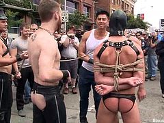 Check this homosexuals dressed up as sadomasochists acting dirty in the middle of the street while people watch them very surprised!