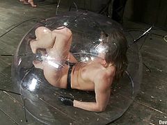 Two smoking hot sex slaves are being humiliated! They get tied up and one of them gets trapped inside the transparent sphere, while the second babe gets arched on it!