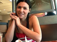 Press play on this hot scene and watch this horny brunette babe fingering her wet pussy while having a latte in a diner.