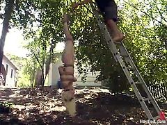 Blonde chick gets tied up and whipped outside the house. Then she gets her tits pinched and pussy toyed by the fucking machine.