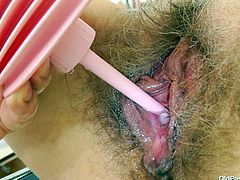 Saggy whore Slaven is at her gynecologist. The doc putted her to take a sit on the special table and then she spread her legs. He putted some lube on her hairy pussy and then asked her to stretch it with a dildo. Now that her pussy is roomy enough, he inserts a speculum to check it out on the inside!