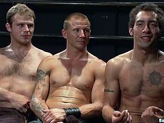 Two muscled dudes get tied up and humiliated by their master. Later on these dudes give a blowjob and get pounded in their asses.