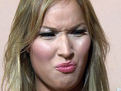 This cute transsexual needs to get clean. She takes a shower and as she is washing her cock she gets horny. She goes over to her man and pulls his cock out of his jeans and then sucks him off and plays with his balls.