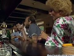This classy lady with white heels and stockings talks to a guy who is rapidly hitting on her. She spreads her legs for him to fuck her on a pool table from a bar.