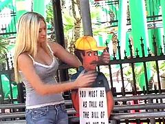 What are you waiting for? Watch this blonde babe, with giant tits wearing jeans, while she takes her clothes off in the middle of the street.