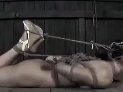 Wenona is a bondage model looking for pain. She is tied up in weird positions and suspended in a barn. Her pussy is tortured with a fixated vibrator so that she can't move it.
