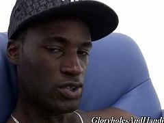 Tyrese sits naked on a sofa and waits for Kyle Foxxx to come and pleasure him. Kyle grabs his big black cock and massages it. He is also teasing Tyrese a lot.