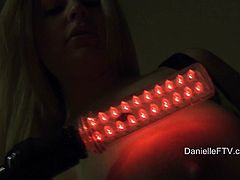 Delightful solo model makes a hot show in a bedroom. She shows her juicy boobs. She turns off the lights and illuminates her body with special lamps.