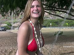 Danielle has a fun day at the beach when she pulls down her top and lets this lucky guy get an eyeful of her amazing tits.