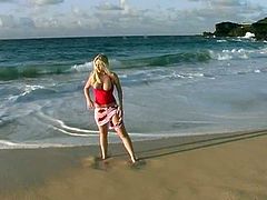 Have a blast watching this blonde doll, with enormous tits wearing a colourful skirt, while she shows her boobs outdoors in a really erotic way.