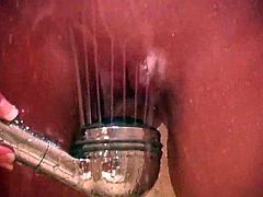 Get wild watching this blonde babe, with big boobs and a shaved kitty, while she plays with the shower-head in her pussy and moans loudly.