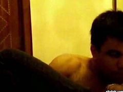 Horny Indian couple starts passionate sex in the bedroom. The guy kisses his girl in a french way while taking off her clothes. He feels up the girl all over.