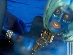 Kinky chick Jessica Drake having blue paint all over her body is getting naughty with some man indoors. She pleases the guy with a blowjob and then takes a fervent ride on his boner.