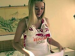 Have fun watching this long haired blonde, with big gazongas wearing a cute bra, while she changes her clothes in front of the camera.