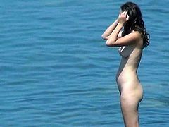 Enjoy voyeur's hidden cam filming nude hottie at the beach