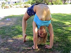 Hot Jessica is doing some acrobatic tricks in a public park. Of course this pretty girl is also showing her nice boobs and pussy.