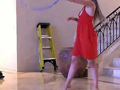 Solo sex model Aurielee plays with a hoop in the living room