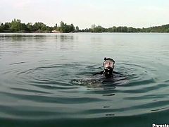 Comely black haired hoochie takes a sun bath in the boat. She opens her tanned legs wide and takes a piss with joy on her face.