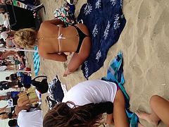 Blonde black thong on beach