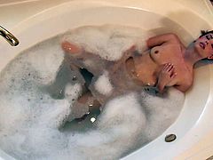 This video consist of two parts. In the first part some brunette girl masturbates while taking a bubble bath. In the second part a blonde babe give a deepthroat blowjob and gets nailed hard.