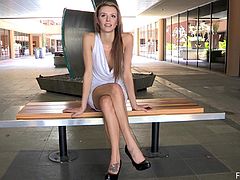 A delightful solo model walks around an empty mall. She lies down on a bench and lifts a dress up to show her nice pussy. After some time Kourtney undresses completely. She shows everything.