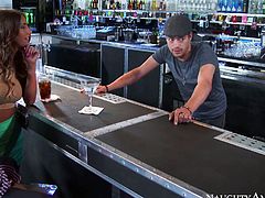 Luxurious brunette August Ames sucks Johnny Castle's cock at the bar