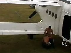 Two muscular military men are playing homosexual games near a plane. One of the guys pleases the other one with a blowjob, then bends over and gets his asshole pounded hard doggy style.