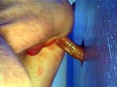 A horny poofter is playing dirty games in a public bathroom. He sucks a gloryhole weiner and then moves his ass up to the gloryhole and gets it drilled hard.