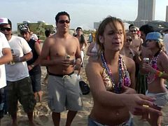 These party girls show off their killer bodies and booties at a wild, drunken beach party. They are ready for a raunchy good time.