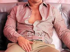 Jake Jammer sits on the couch facing an attractive dude. They both jerk off their cocks before touching each other. When they get to the touching part, Jake takes cock in his ass hole.