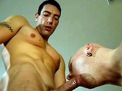 A brunette dude gives a hot blowjob to his bald boyfriend. After that he lies down on a floor and gets fucked doggystyle.