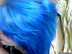 Punky slut with big boobs and blue hair is sucking hard dong balls deep. The guy grabs her head pushing solid dick deep up her throat.